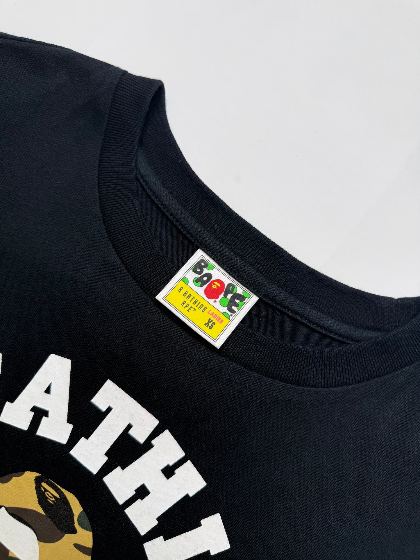 BAPE LADIES COLLEGE LOGO TEE – TIGER CAMO GOLD (XS)