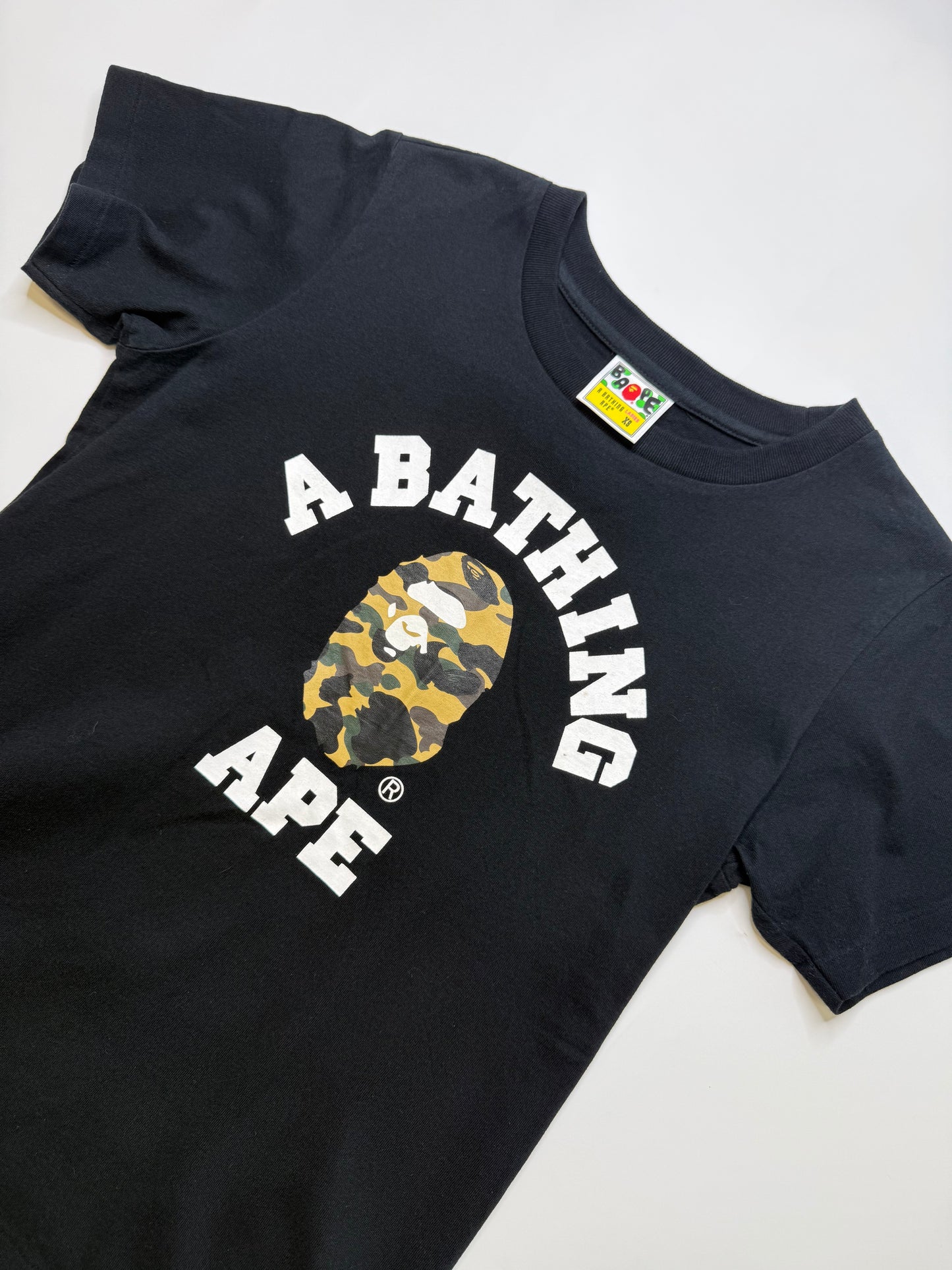 BAPE LADIES COLLEGE LOGO TEE – TIGER CAMO GOLD (XS)