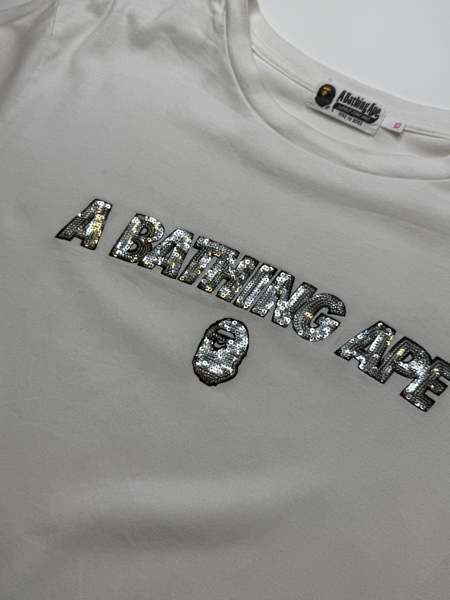 BAPE 30TH ANNIVERSARY SEQUIN LOGO TEE – WHITE (XS)